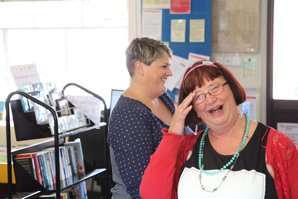 Sarah - support worker smiling while at work