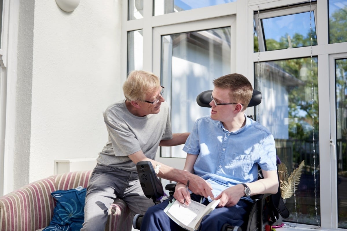 carer and man in wheelchair