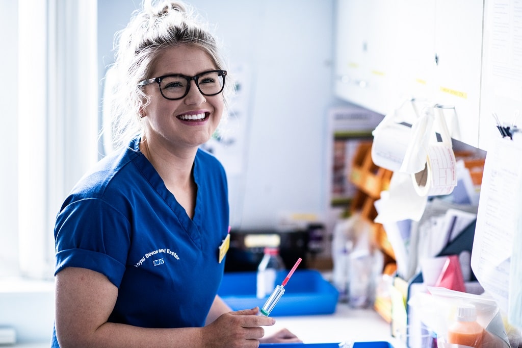 Registered nurse preparing medicines