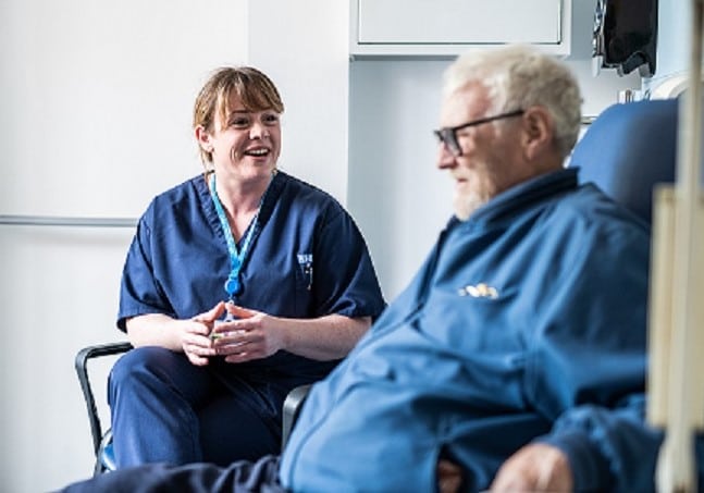 Louise the podiatrist sat talking to a patient