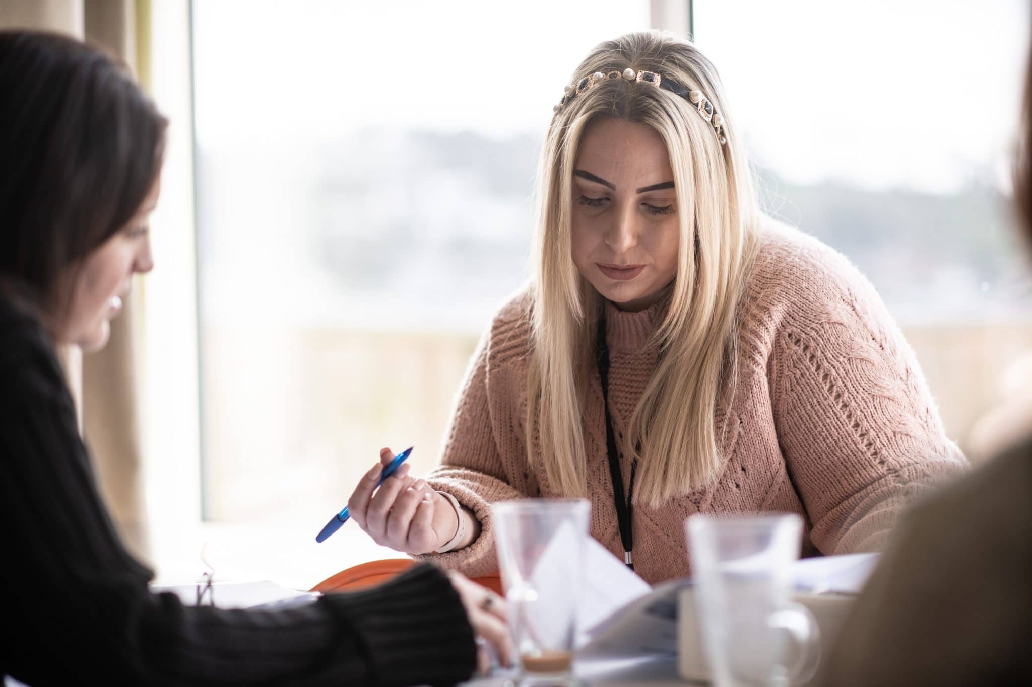Registered manager completing paperwork with her work colleague