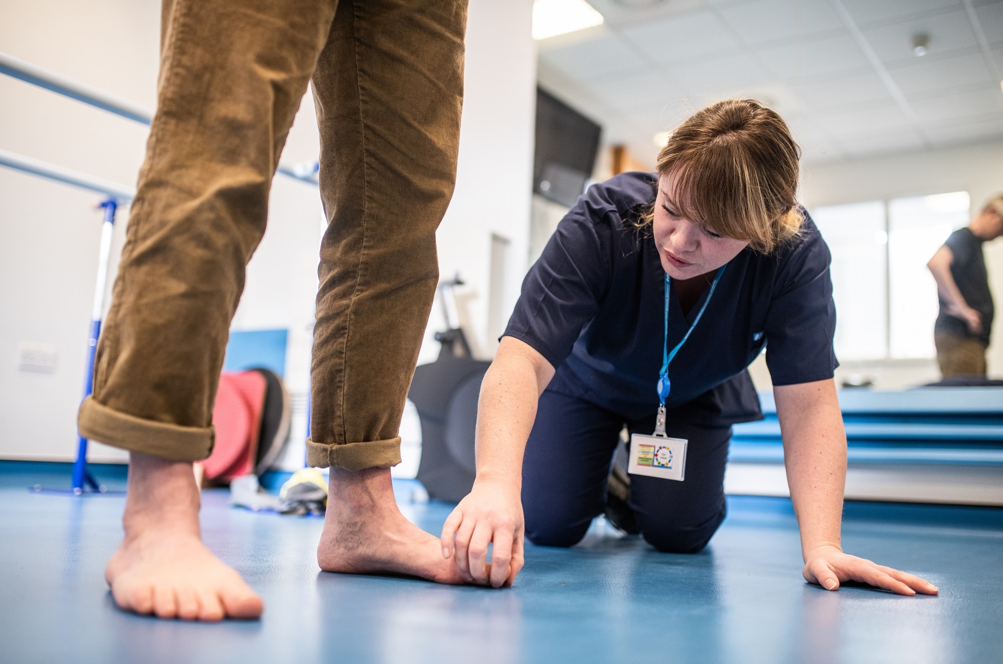 Podiatrist checking patients feet