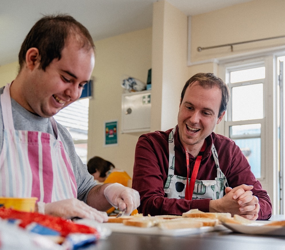 Support worker Ric, helping a young person to make sandwiches.