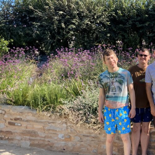 A group of four people in a garden