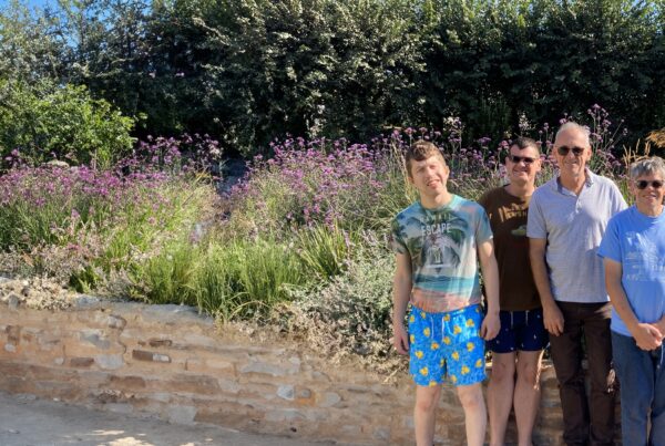 A group of four people in a garden