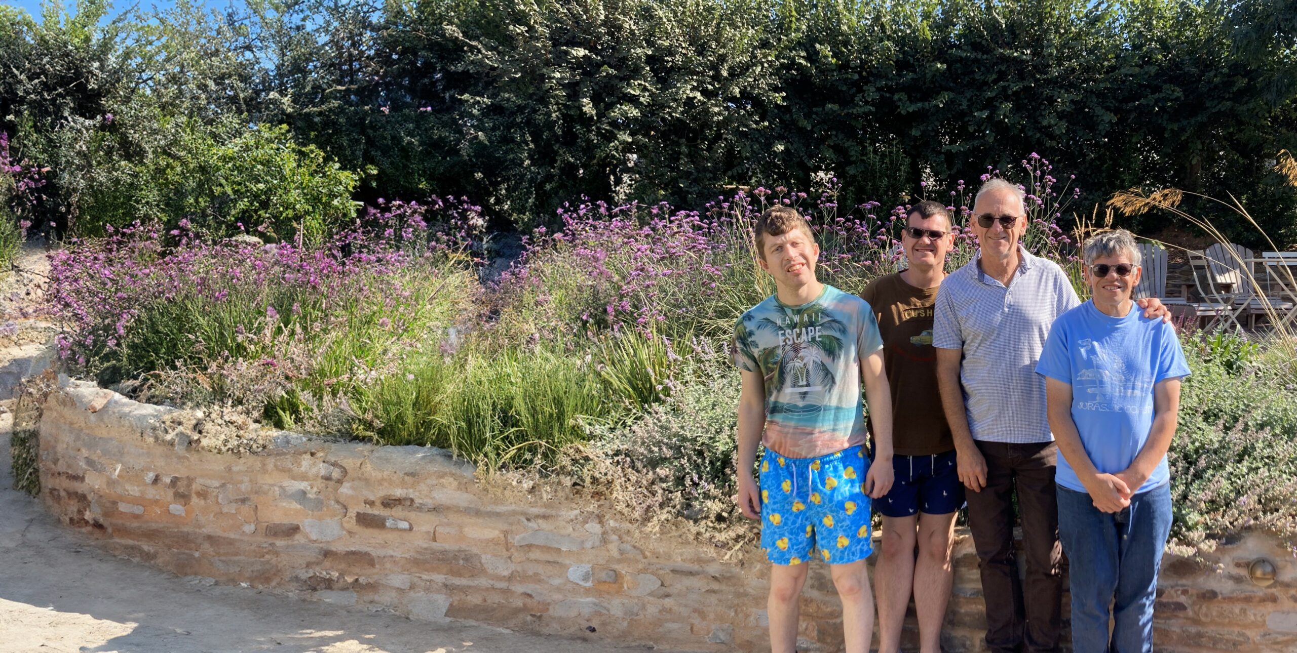 A group of four people in a garden