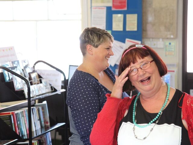 Sarah - support worker smiling while at work