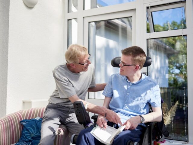 carer and man in wheelchair