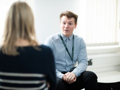 Social worker talking to a colleague