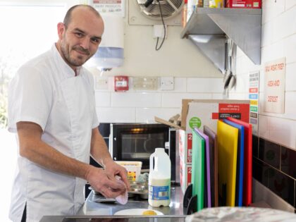 A cook working in a kitchen